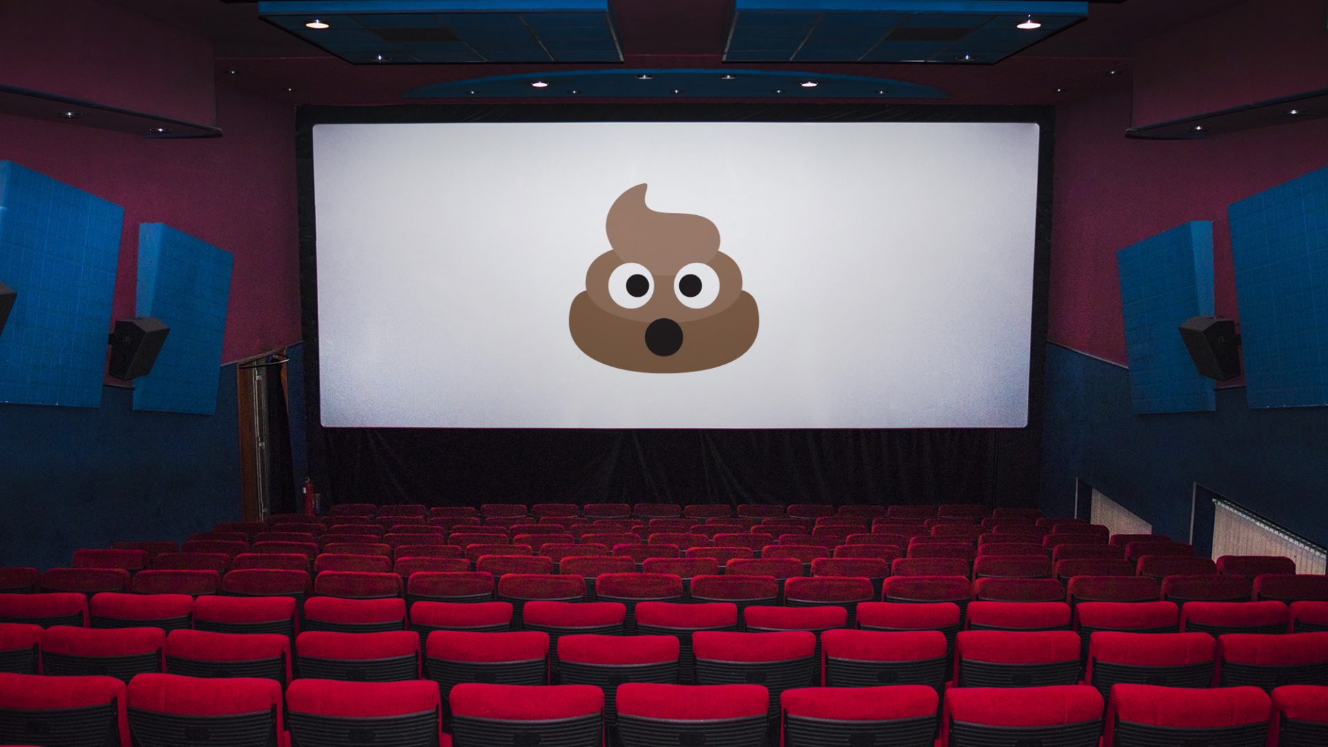 A movie theater with a big poop emoji placed on the screen
